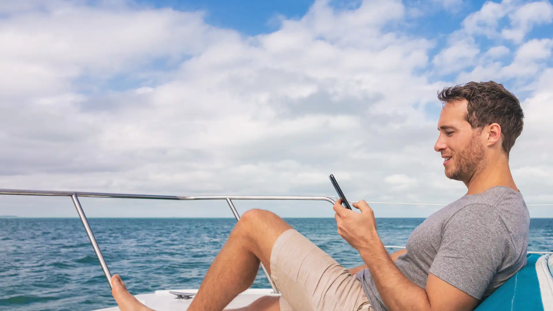 Couple enjoying yacht on the water.